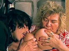 Granny with gigantic tits sucking cock and gets fucked on